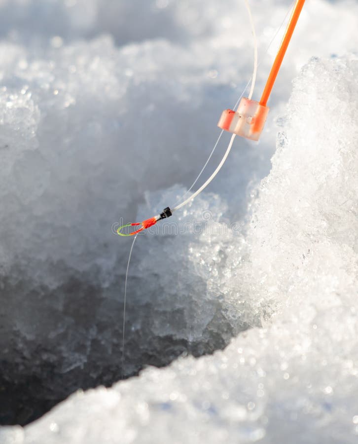 Fishing rod on ice in winter. Ice fishing royalty free stock photos