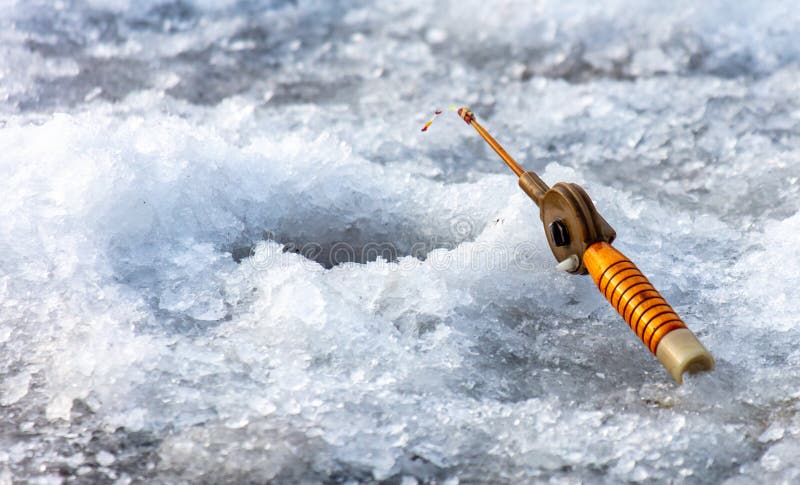 Fishing rod on ice in winter. Ice fishing stock images