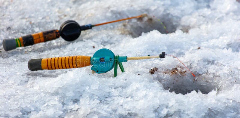 Fishing rod on ice in winter. Ice fishing royalty free stock photos