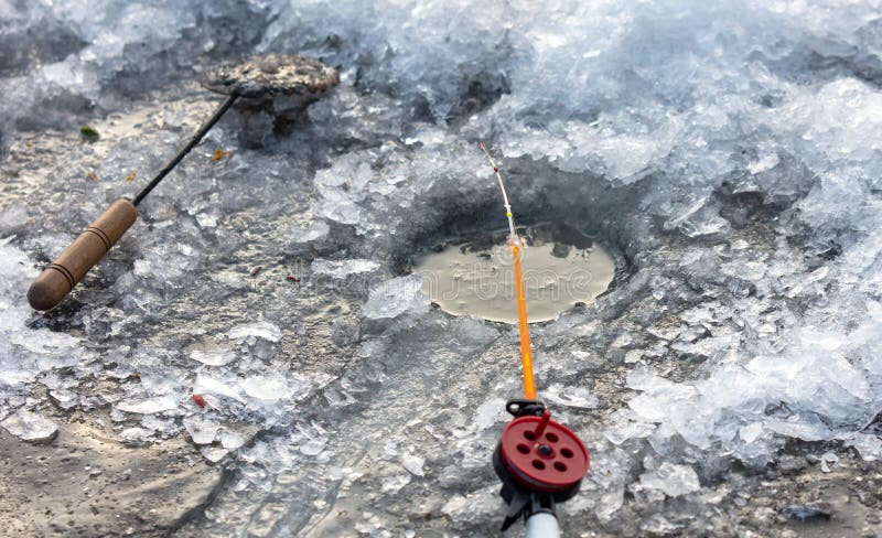 Fishing rod on ice in winter. Ice fishing stock photography