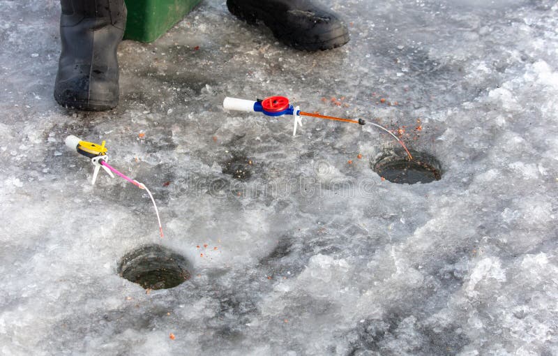 Fishing rod on ice in winter. Ice fishing royalty free stock photos