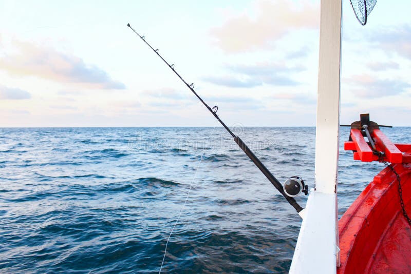 Fishing rod are prepared to offshore fishing on the boat in ocean.