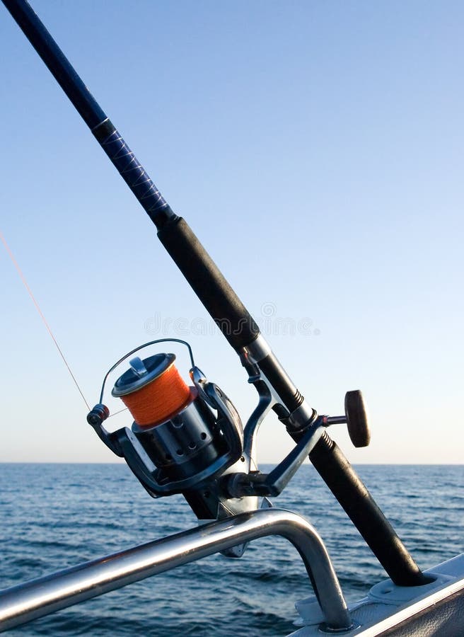 Fishing rod reel at sea. stock photo. Image of deep, rail 2376640