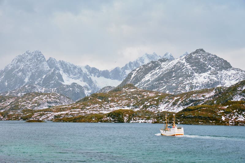 Fishing ship in fjord in Norway royalty free stock photo Fishing ship in fjord in Norway royalty free stock photo