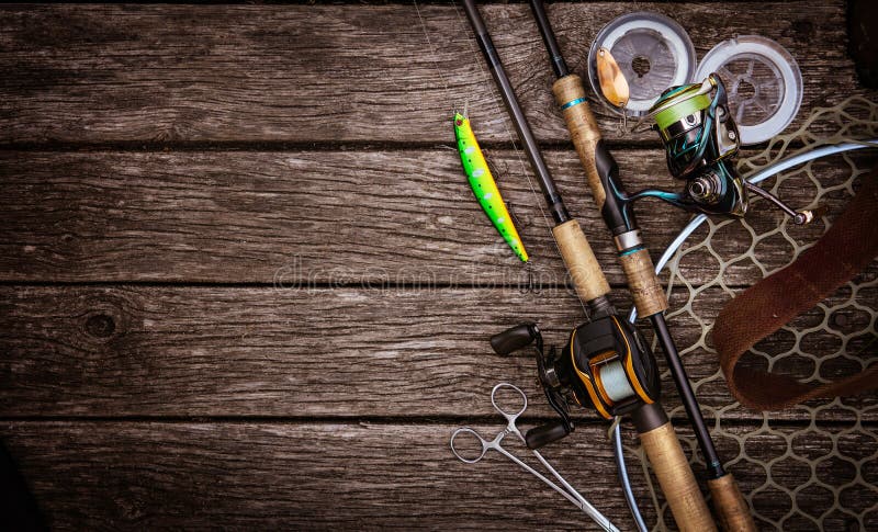 Fishing tackle composition, wood background.