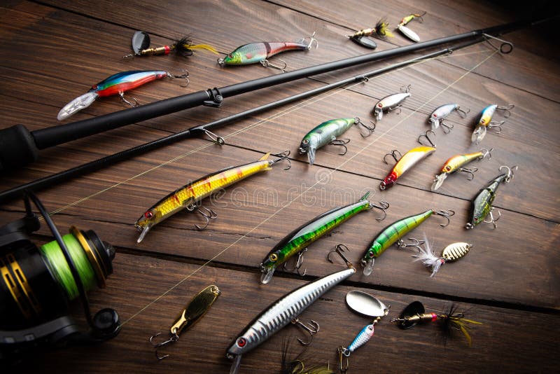 Fishing Tackle - Fishing Spinning Rod, Hooks and Lures on Wooden  Background. Active Hobby Recreation Concept Stock Photo - Image of active,  recreation: 239559938