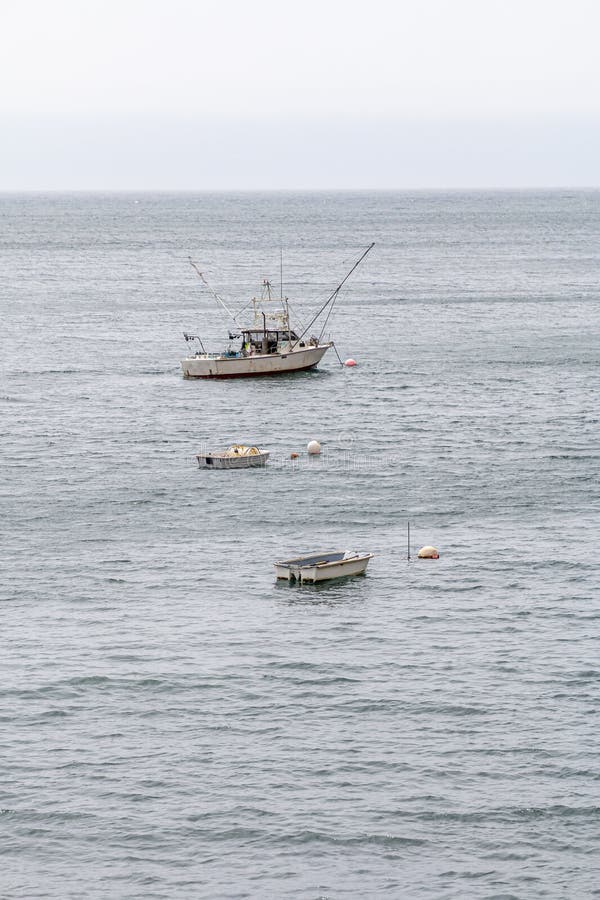 A Fishing Trawler is at Anchor in a Ocean Bay. Stock Photo Image of