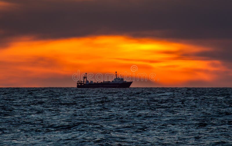 Fishing Trawler In Sunset