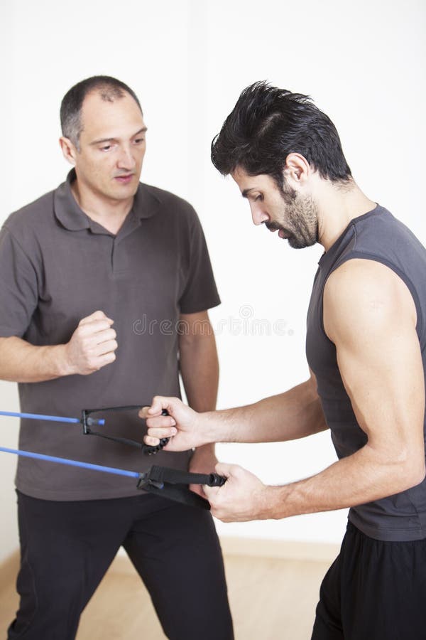 Physiotherapist helping patient with exercise. Physiotherapist helping patient with exercise