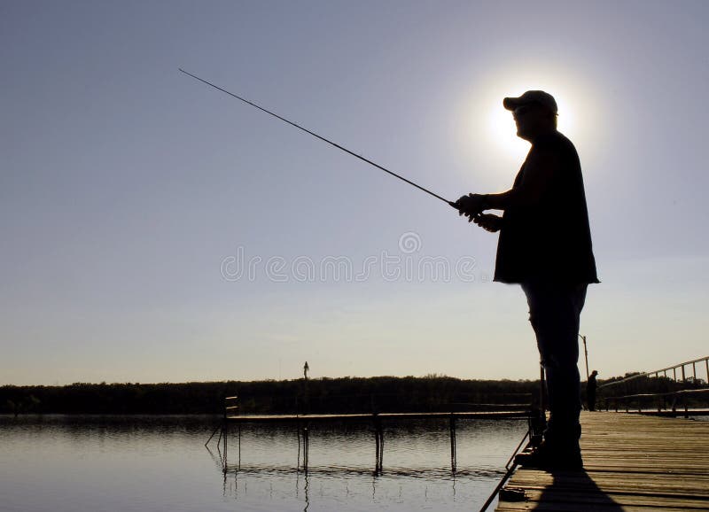 fiskaresilhouette fotografering för bildbyråer fiskaresilhouette fotografering för bildbyråer