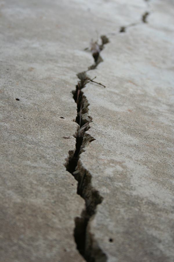 Close-up view of a crack in concrete. Close-up view of a crack in concrete