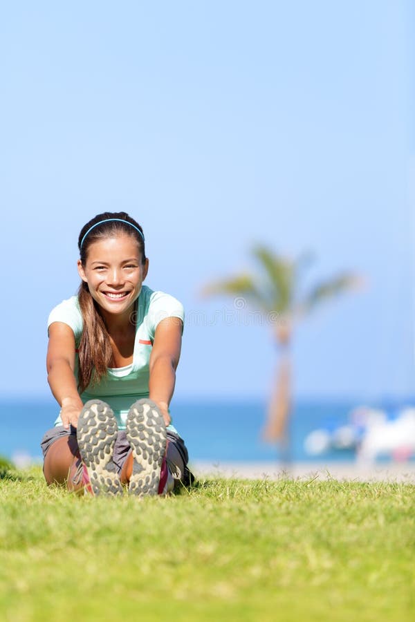 Fit fitness woman stretching exercises outdoors stock photography Fit fitness woman stretching exercises outdoors stock photography