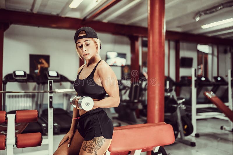 Fit girl exercise in gym. stock photo. Image of young 210760938