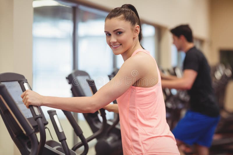 Fit People Working Out Using Machines Stock Photo - Image of focused ...