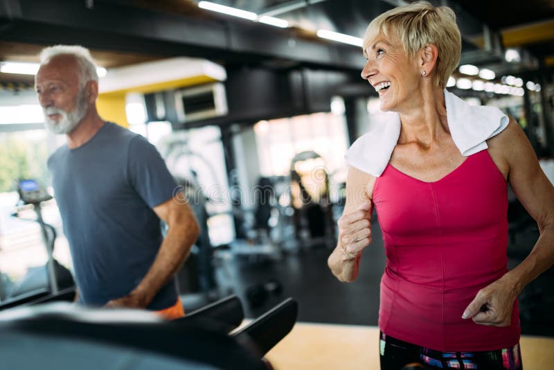 French And Fit Senior Fit Senior Sporty Couple Working Out Together at Gym Stock Image