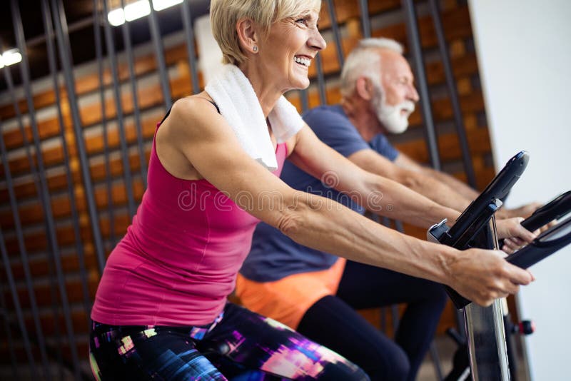 French And Fit Senior Fit Senior Sporty Couple Working Out Together at Gym Stock Image