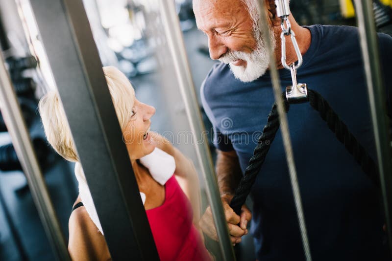 Fit Senior Sporty Couple Working Out Together At Gym Stock Image