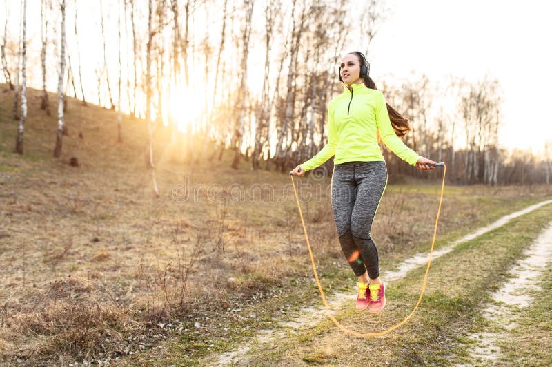 A Fit Woman Jumping with a Skipping Rope Outdoors Stock Photo - Image ...