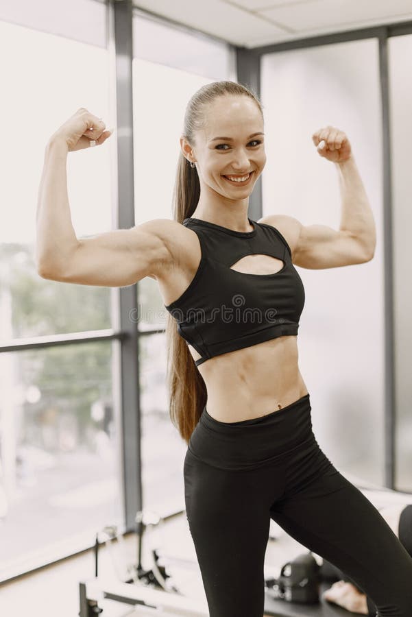 Perfect Bicep. Beautiful Young Sporty Woman Examining Her Bicep