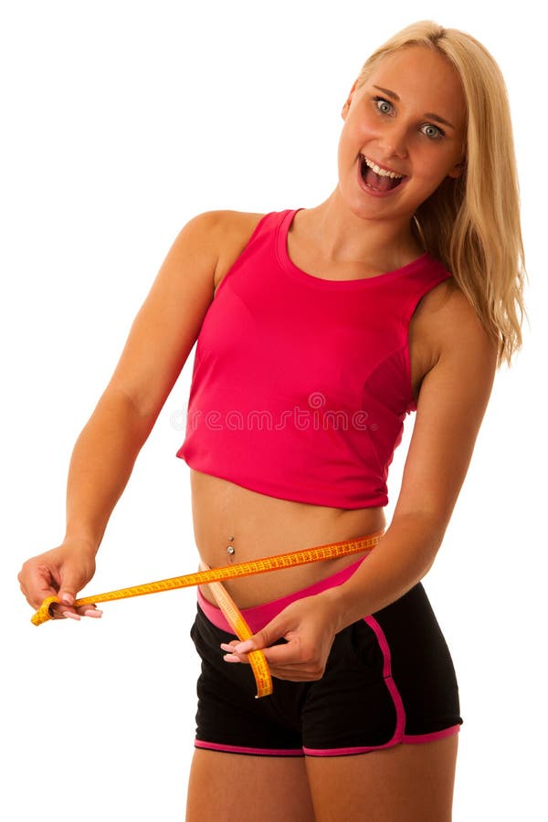 Fit woman with scale measuring her waste stock photography Fit woman with scale measuring her waste stock photography