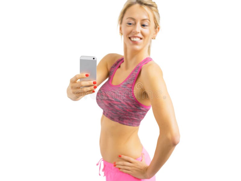 Fit woman taking mirror selfies