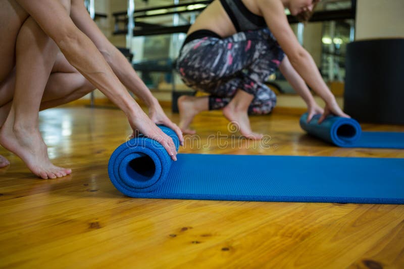 Fit Women Rolling Up Exercise Mats Workout Stock Photos Free