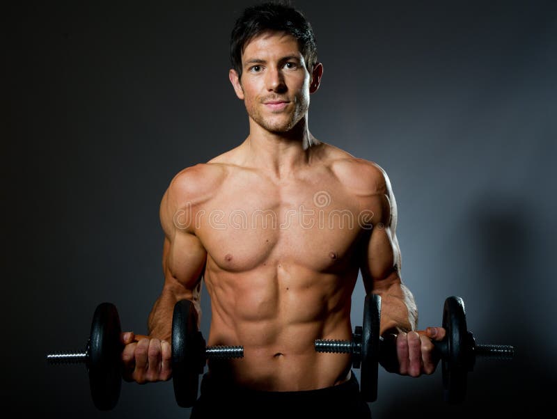 Fit young male with great healthy body and dumbells