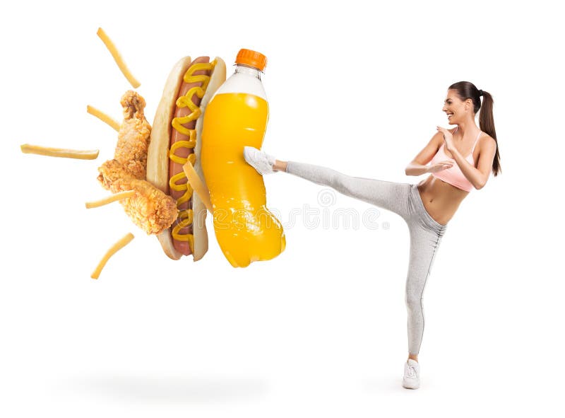 Fit young woman fighting off soda and junk food