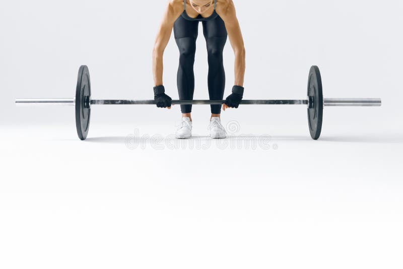 Fit young woman lifting barbell stock photography Fit young woman lifting barbell stock photography