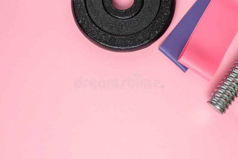 Fitness Background. Elastic Bands for Stretching on a Pastel Pink ...