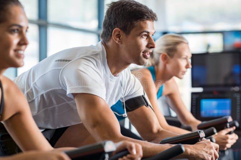 Fitness class biking at gym