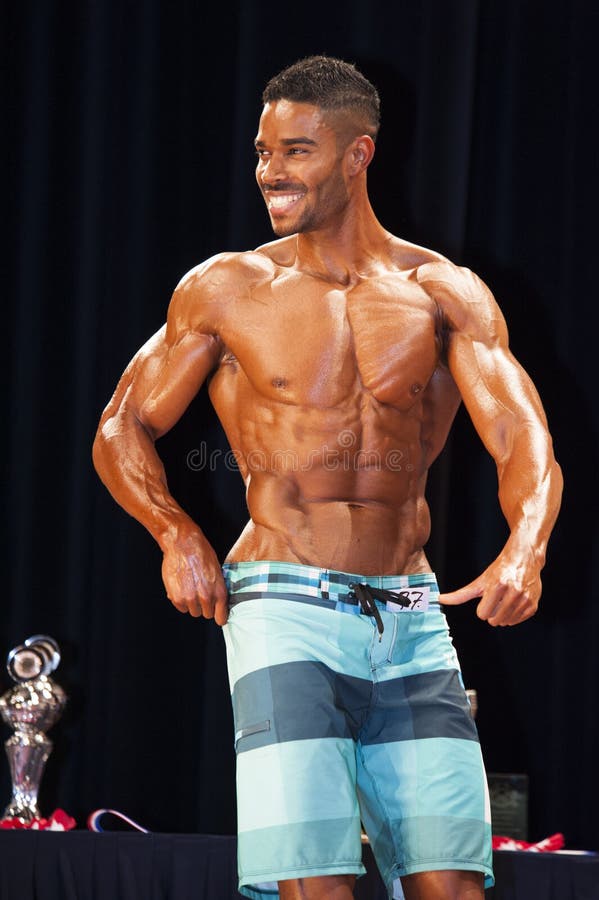 Male bodybuilding contestantdoing a chest pose – Stock Editorial Photo ©  YellowPaul #58218421