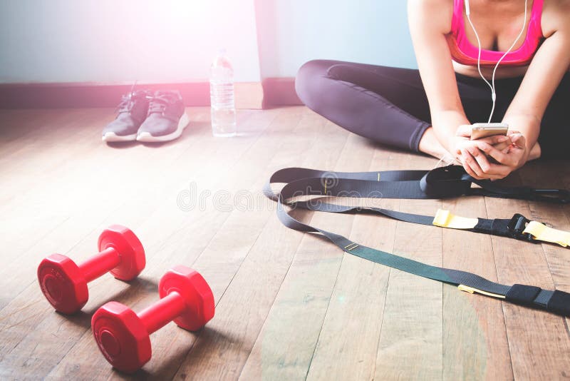 Fitness Female in Black Pants Stretching and Listening after Workout ...