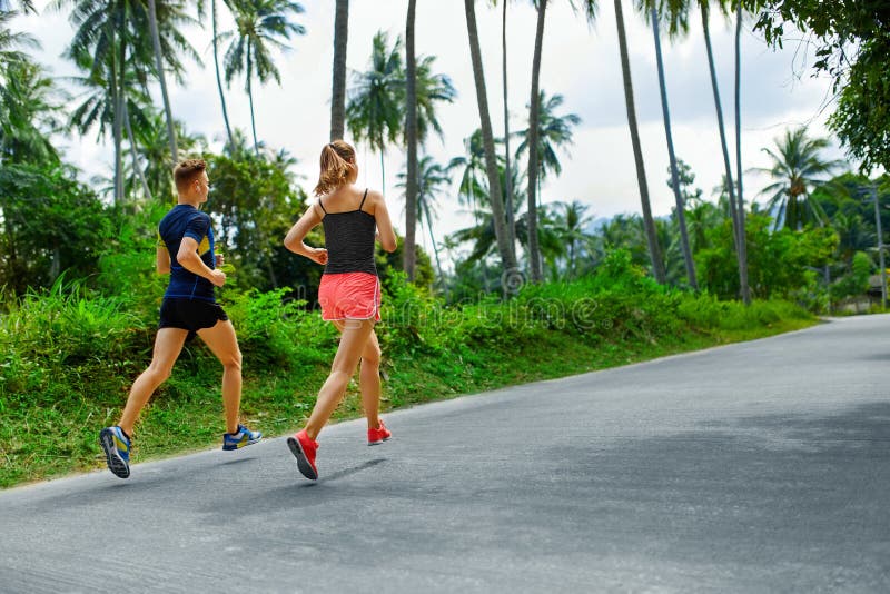 Fitness. Fit Athletic Couple Running. Runners Jogging. Sports. H stock photo Fitness. Fit Athletic Couple Running. Runners Jogging. Sports. H stock photo