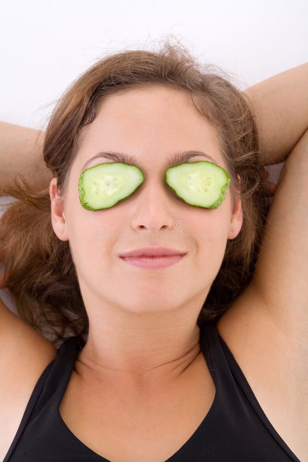 Fitness girl and cucumber