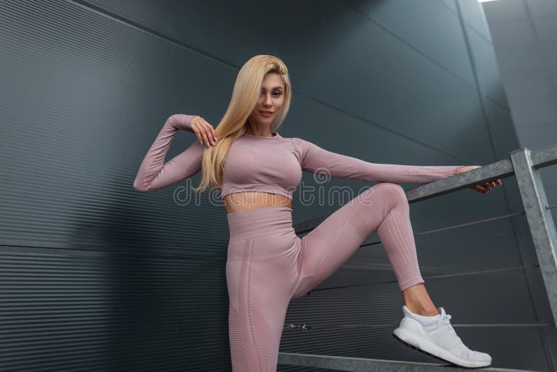 Stylish Young Fitness Model Woman in Trendy Sportswear with Fashion White Near Black Metal Wall in the City Stock Image - Image of adult, activity: 245288545