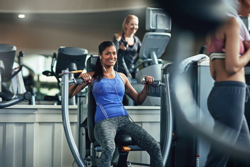 Crushing those Fitness Goals. a Young Woman Working Out with a Chest Press  at a Gym. Stock Photo - Image of inside, ethnicity: 275594772