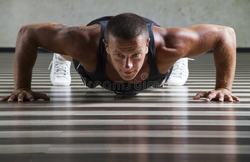 Fitness instructor doing push ups