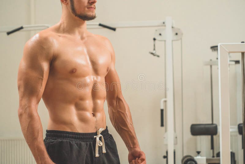 Fitness Instructor In The Sport Room Background. Male Model With Muscular  Fit And Slim Body Stock Image - Image Of Clothes, Kettle: 160621303