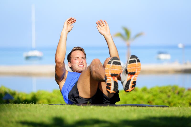 Fitness man doing sit-ups exercise for abs stock image Fitness man doing sit-ups exercise for abs stock image