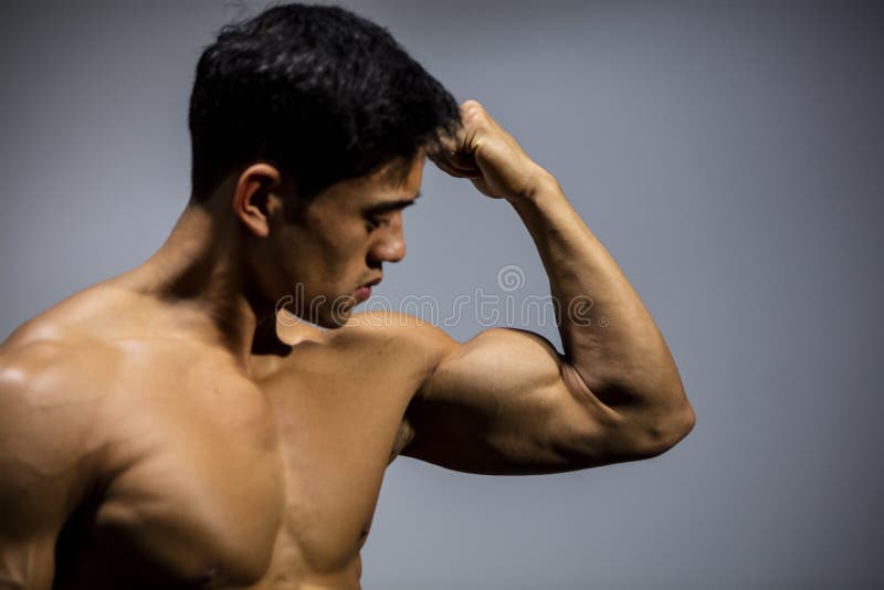 Male Fitness Model Flexing Pectoral Muscles Stock Image Image of