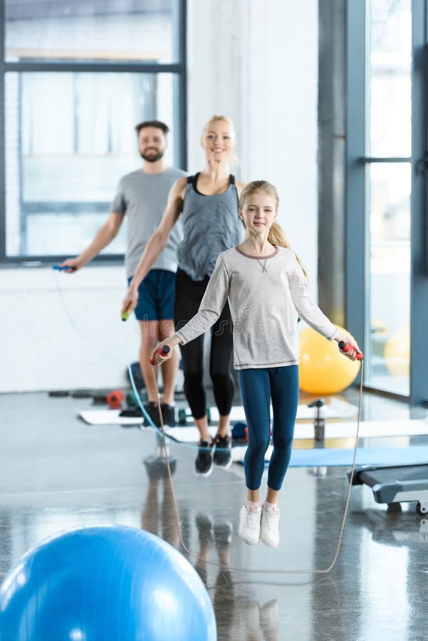 Fitness people exercising with skipping ropes at sports center stock images Fitness people exercising with skipping ropes at sports center stock images