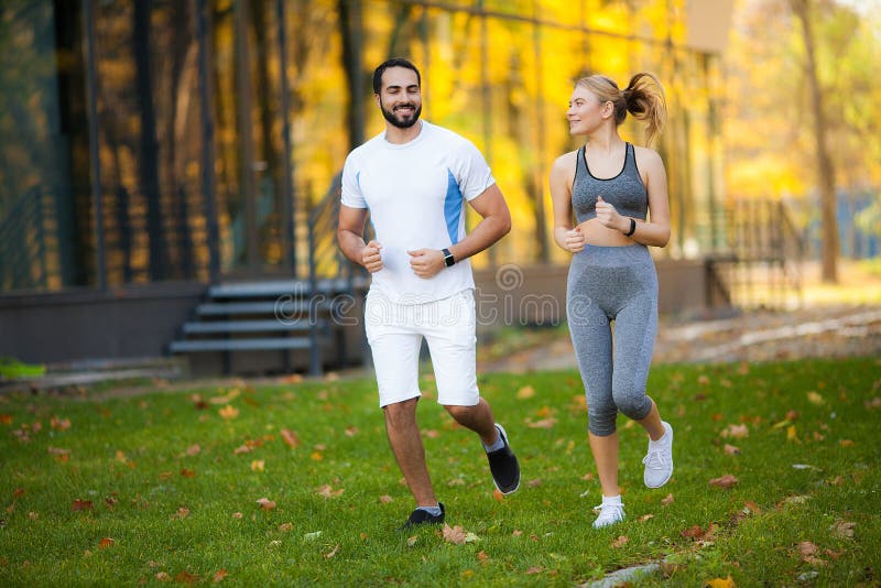 Fitness. Personal Trainer Takes Notes While Woman Exercising Outdoor royalty free stock photography Fitness. Personal Trainer Takes Notes While Woman Exercising Outdoor royalty free stock photography