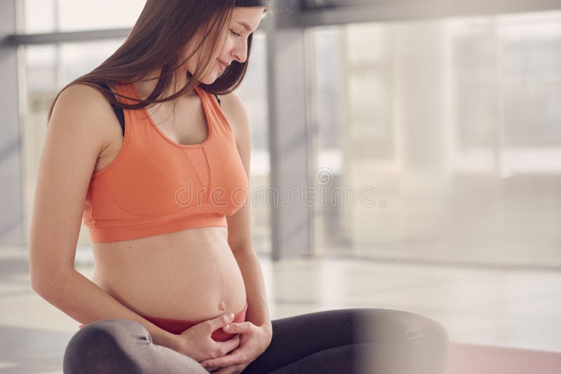 Fitness Pregnant woman sitting