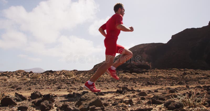 Fitness - Runner running on desert road sprinting fast in compression clothing