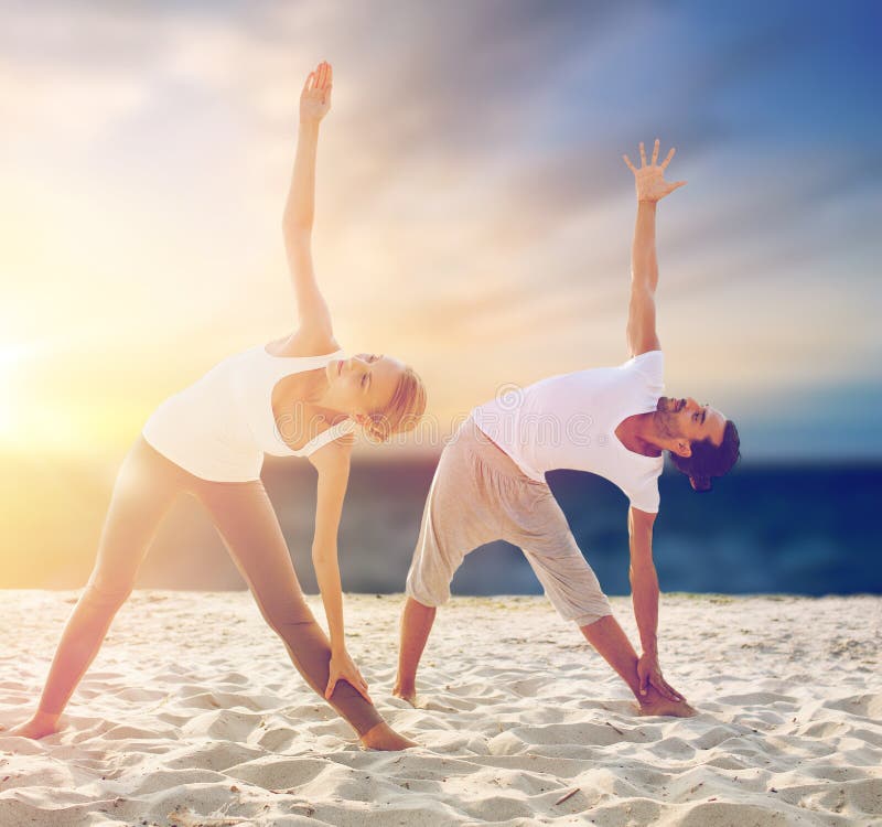 Download Couple Making Yoga Exercises On Beach Stock Image - Image of beach, exercising: 110940351
