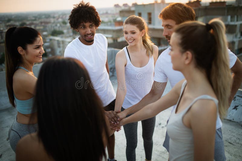 Fitness, sport, training and healthy lifestyle concept - group of happy people exercising outdoor royalty free stock photos Fitness, sport, training and healthy lifestyle concept - group of happy people exercising outdoor royalty free stock photos