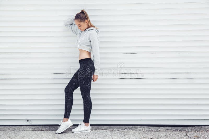Fitness sporty girl wearing fashion clothes royalty free stock images Fitness sporty girl wearing fashion clothes royalty free stock images