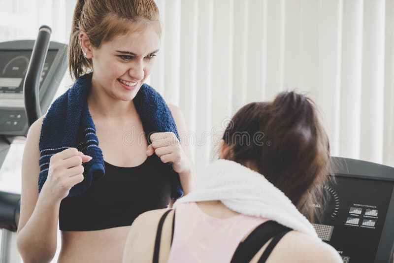 Fitness trainer encouraging friend to train harder royalty free stock image Fitness trainer encouraging friend to train harder royalty free stock image