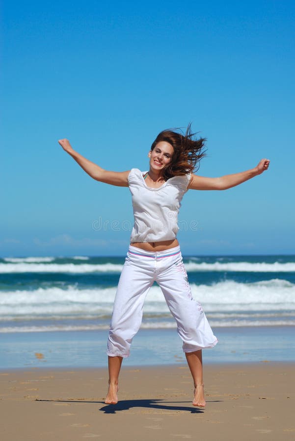 Fitness woman on beach